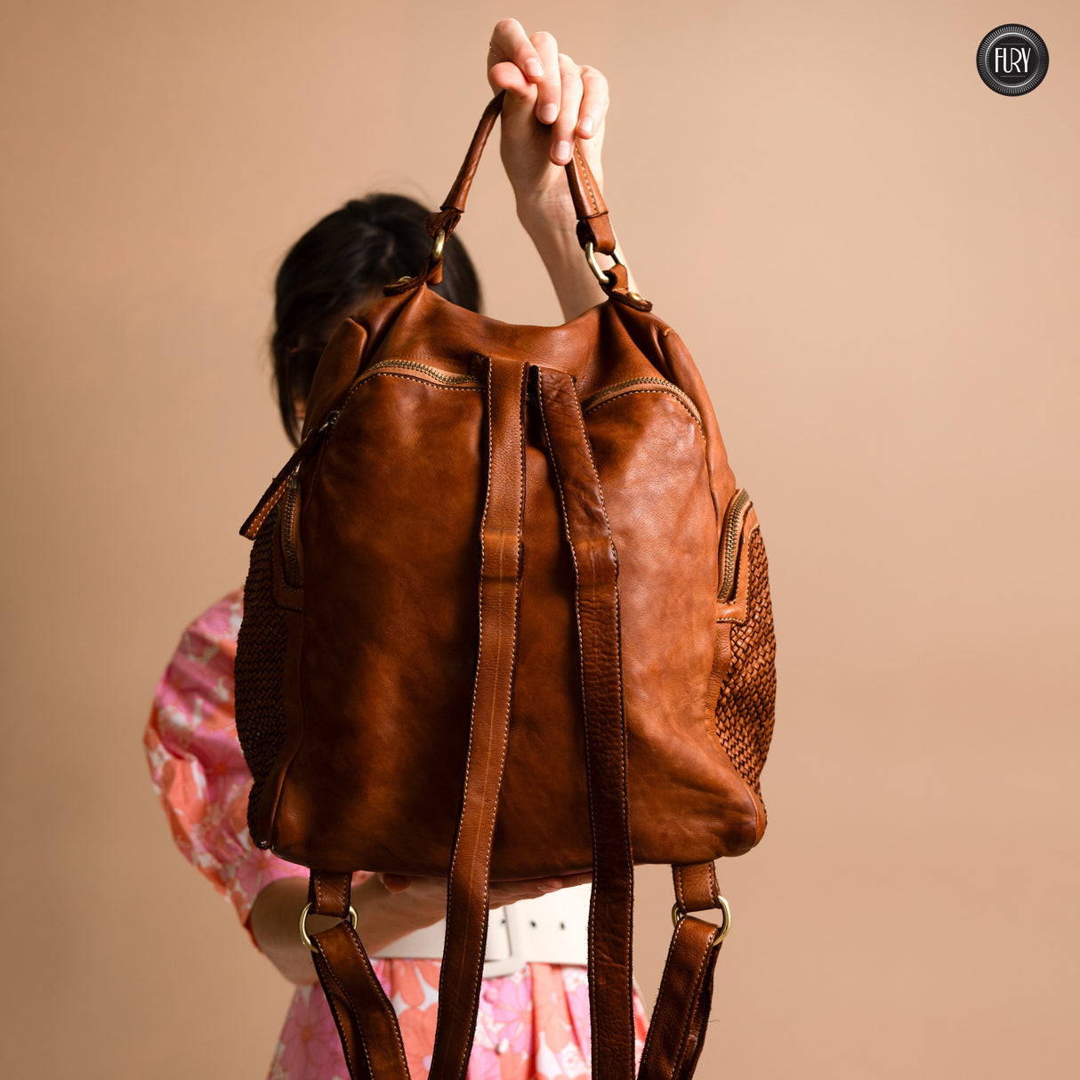 Multi-pocket backpack in woven leather