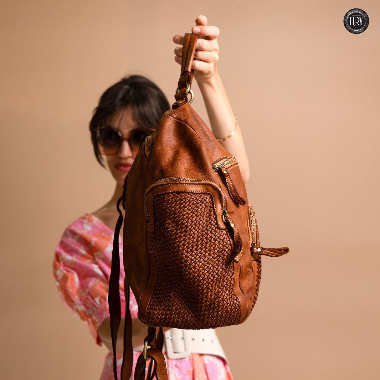 Multi-pocket backpack in woven leather