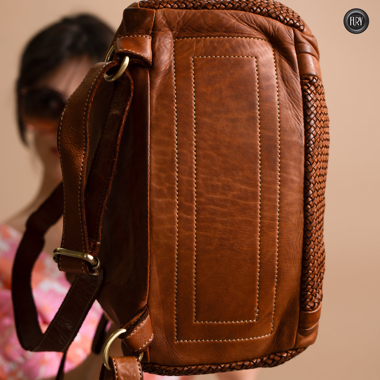 Multi-pocket backpack in woven leather