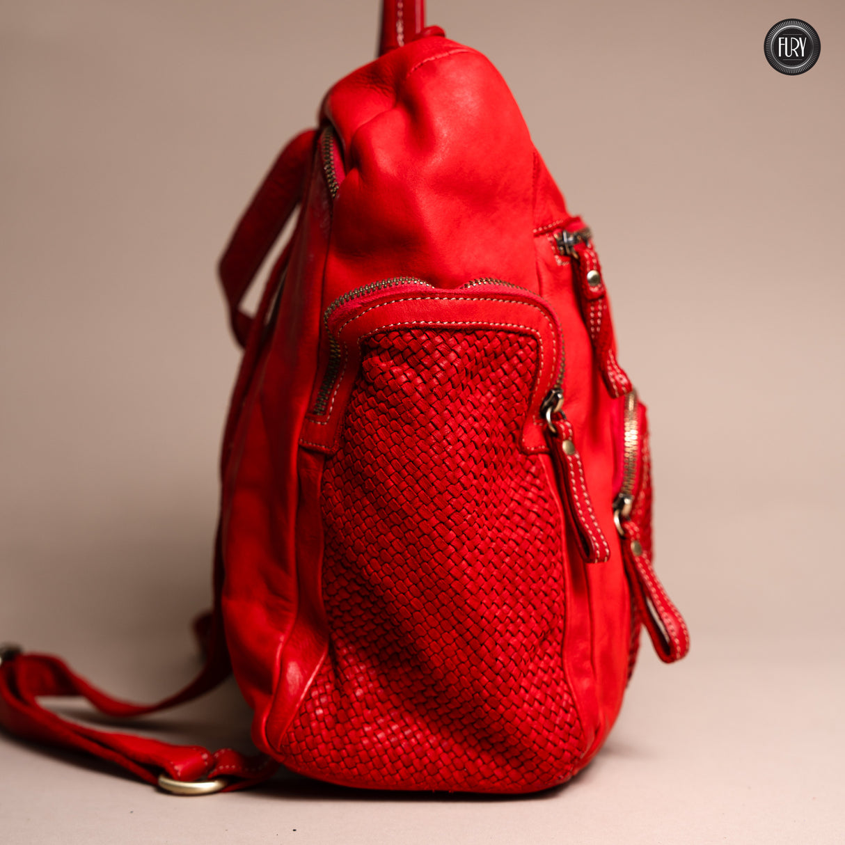 Multi-pocket backpack in woven leather