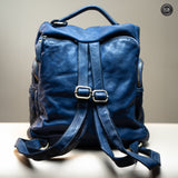 Multi-pocket backpack in woven leather